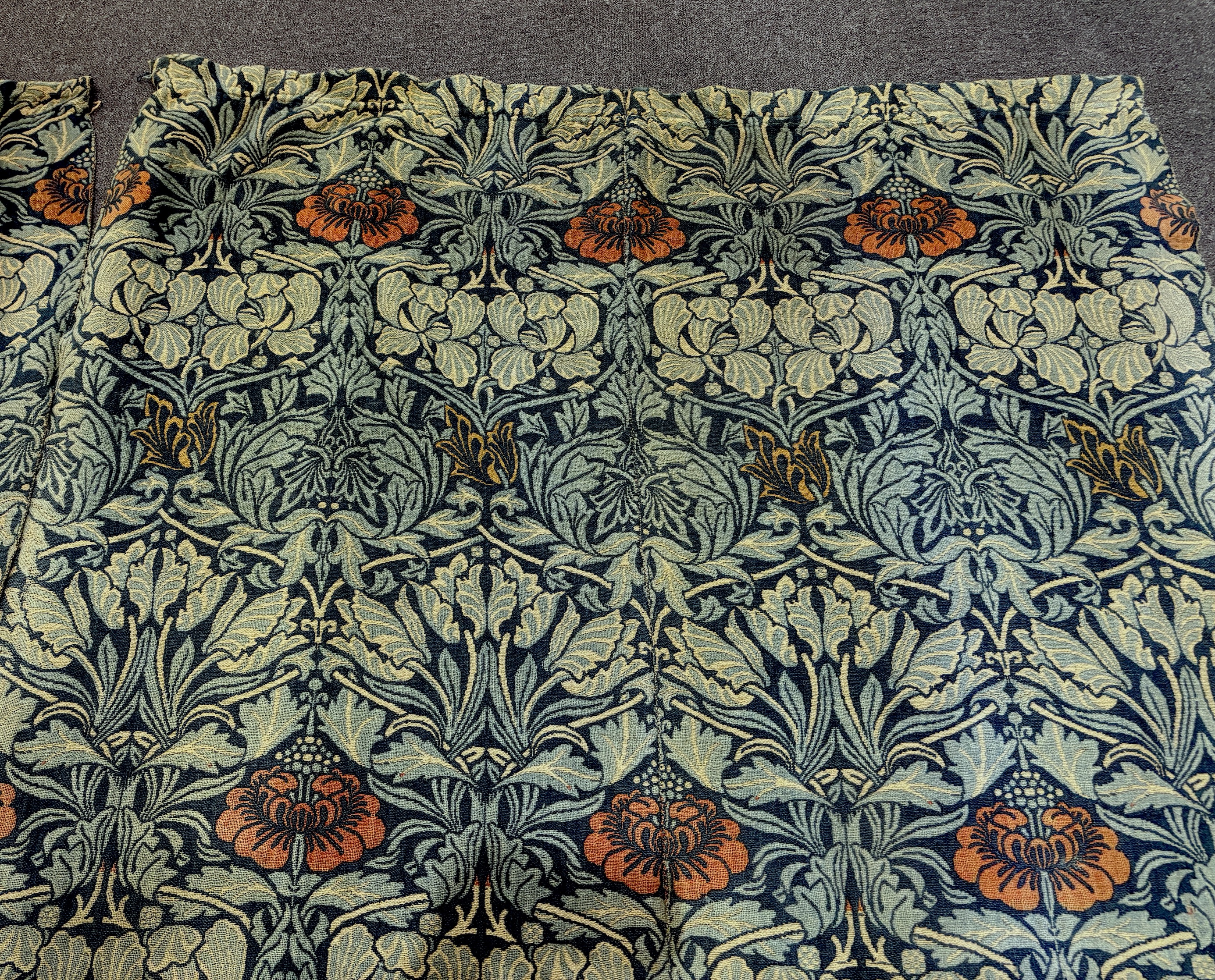 William Morris (1834-1896). Four panels of ‘Tulip and Rose’ triple woven wool and linen mix being two lengths sewn together creating a pair of wider curtains widest curtain (of two panels) 189cm wide x 158cm long, Single